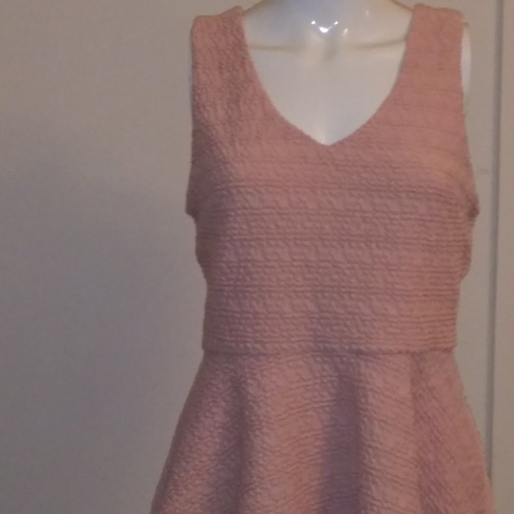 Pink sleeveless empire waist blouse